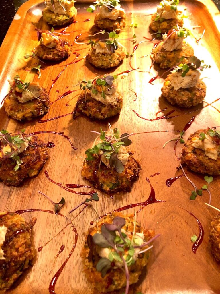 Sushi rolls on a wooden serving plate.